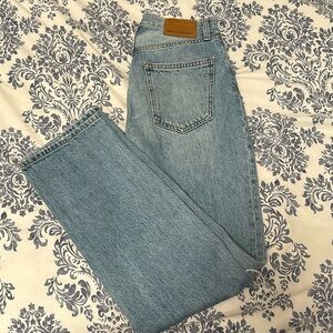 Women’s jeans high rise with buttons. Ripped and wide straight leg.